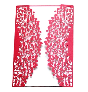 Elegant red laser-cut invitation card with intricate vine patterns for weddings and festivals