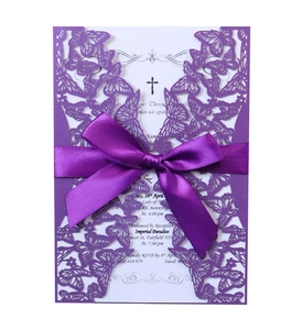 Elegant purple laser cut butterfly wedding invitation with a satin bow and inner card