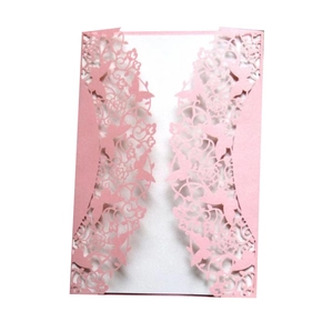Detailed laser-cut pattern featuring butterfly and floral motifs on pink wedding invitation