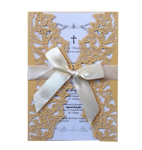 Golden laser-cut butterfly wedding invitation card with elegant cream white ribbon bow