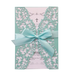 Detail of laser-cut tiffany blue invitation folder with pink card and blue satin bow