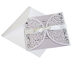Laser cut white floral wedding invitation with lavender inner card and satin ribbon set