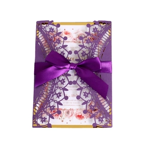 Elegant purple laser cut wedding invitation with ribbon bow and floral inner card