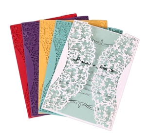 Detailed laser-cut vine patterns on multicolored wedding invitations set