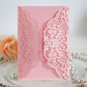 Pink laser-cut lace wedding invitation with pearlescent finish and floral hollow pattern