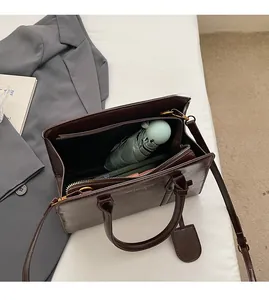 Macro view of deep coffee tote bag interior showing large capacity for daily items