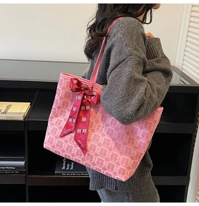 Detail of pink tote bag with Double Happiness patterns and red silk ribbon decoration
