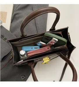 Top view of dark brown faux crocodile leather bag showing internal storage space
