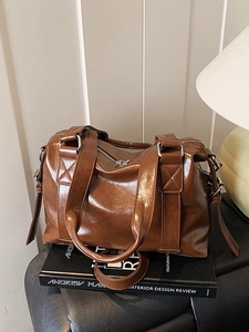 Retro deep brown glossy leather Boston bag with double handles and adjustable strap