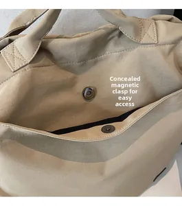 Detailed macro view of the invisible magnetic closure and reinforced cross stitching