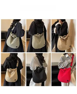 Canvas crossbody bag detail showing various colors like black, khaki, and red in usage