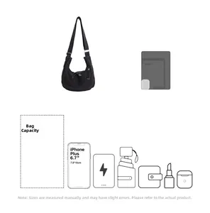 Internal capacity of the black crescent crossbody bag showing storage for a 6.7-inch phone