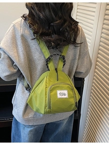 Green plaid canvas backpack with large capacity and lightweight design for women