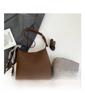 Brown litchi grain leather bag set with patterned silk scarf and inner pouch detail