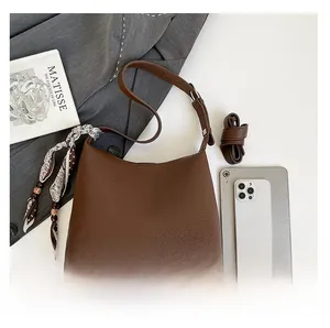 Brown lychee leather tote bag with silk scarf detail and size comparison with iPad