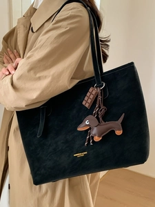 Black matte tote bag with shoulder strap featuring cute dachshund and chocolate charms
