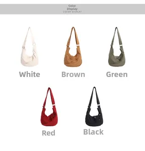 Canvas crescent bags shown in white, brown, green, red and black with zip closure