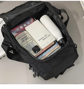 Spacious main compartment of black nylon backpack showing ample storage for tablets and books