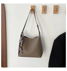 Brown lychee grain leather tote bag with elegant decorative silk scarf detail