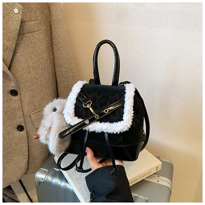 Mini black leather backpack with fluffy white faux fur trim and cute rabbit charm