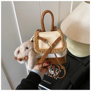 Mini cream and brown patent leather backpack with faux fur trim and plush bunny charm