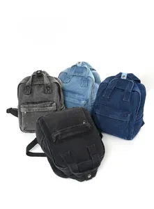 Detailansicht der gewaschenen Denim-Rucksäcke in Schwarz, Grau, Hellblau und Dunkelblau