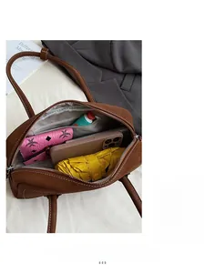 Detailed interior view showing multi-pocket compartments and large capacity of Boston bag
