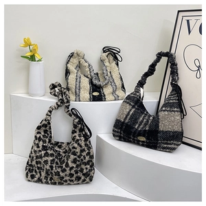 Close-up of plush tote bags in leopard, striped, and plaid textures with ruffled straps