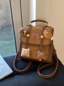 Brown vintage suede backpack with cute cartoon cookie patches and checkered bow detail