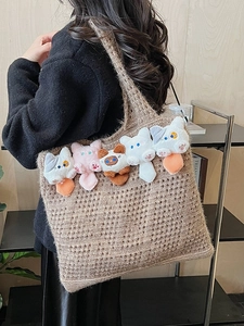 Brown hollow-out knitted tote bag featuring cute plush cat heads and soft knit texture