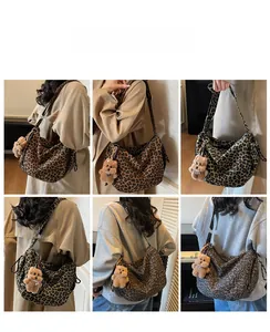 Detail showing leopard print tote bags in two colors with plush bear charm accessory