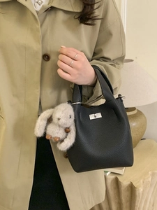 Classic black litchi texture leather bucket bag with cute plush rabbit charm