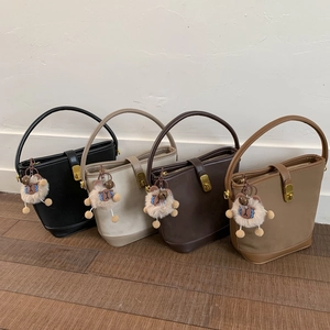 Vintage suede bucket handbags in four colors with cute sheep charms and gold turn-locks