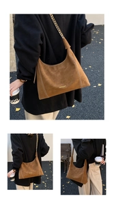 Detail of brown suede hobo bag with contrast stitching and gold chain leather strap