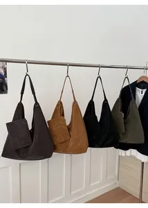 Detail of four colorful minimalist tote bags showing textured leather and matching straps