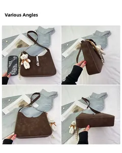 Detailed views of a minimalist coffee-colored suede half-moon shoulder bag with a bear charm