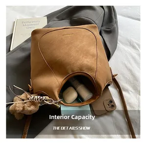 Detailed view of brown leather bucket bag interior showing large storage capacity