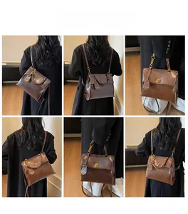 Detail showing vintage dark brown leather backpack styles with metallic twist lock