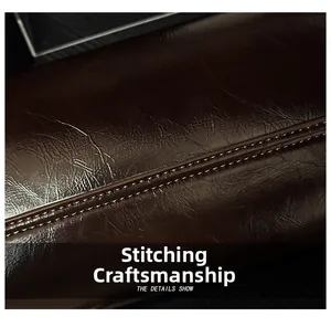 Macro shot of precise stitching on deep brown textured leather for a shoulder bag