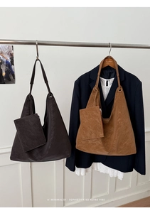 Detail view of large retro tote bags in coffee and caramel with matching mini pouches