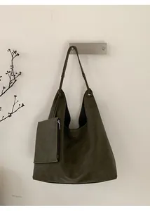 Detail view of large vintage olive green hobo bag with a matching small zipper pouch