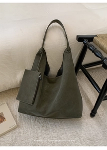Close-up of olive green tote bag set with a small matching zippered inner pouch