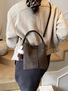 Retro deep brown suede bucket bag with stylish plush heart charm for autumn winter style