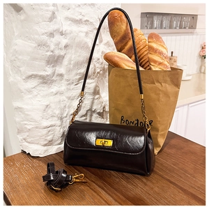 Deep brown oily leather shoulder bag with gold twist lock and dual strap details