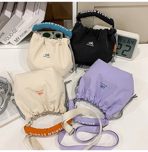 Nylon drawstring bucket bags in multiple colors with adjustable shoulder straps