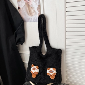 Detail of black plush tote bag featuring two cute 3D cat plush dolls on the front pockets