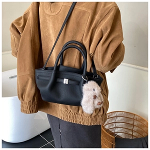 Litchi pattern black leather bucket bag with silver buckle and plush rabbit charm
