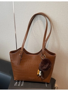 Vintage brown crocodile embossed bucket bag with plush charm and large capacity