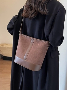 Vintage brown faux suede bucket bag with leather accents for versatile crossbody wear