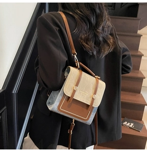 Chic retro two-tone backpack shown on model featuring beige suede and brown leather details